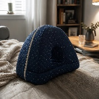 Aline side-sleep pillow on a made bed